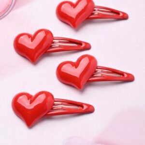 Broches rojos de corazon